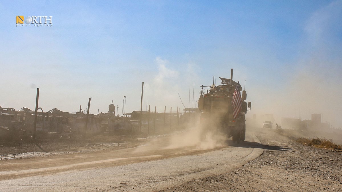 A US patrol roams near the Sweidiya gas plant and oil stations in the countryside of Derik in far NE_Syria after being hit by Turkish airstrikes