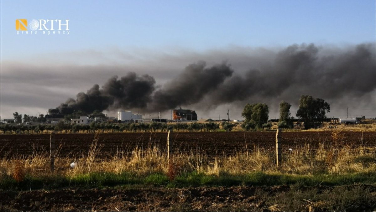 Columns of smoke rise from oil fields near the town of Tirbe Spiyeh (al-Qahtaniya) in the eastern province of Qamishli in northeastern Syria as a result of Turkish airstrikes