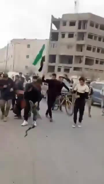 Kurdish sources claim that they are not behind shooting protesters in Raqqa and post this video to demonstrate that someone amongst the protesters is holding a PKC machine gun shooting
